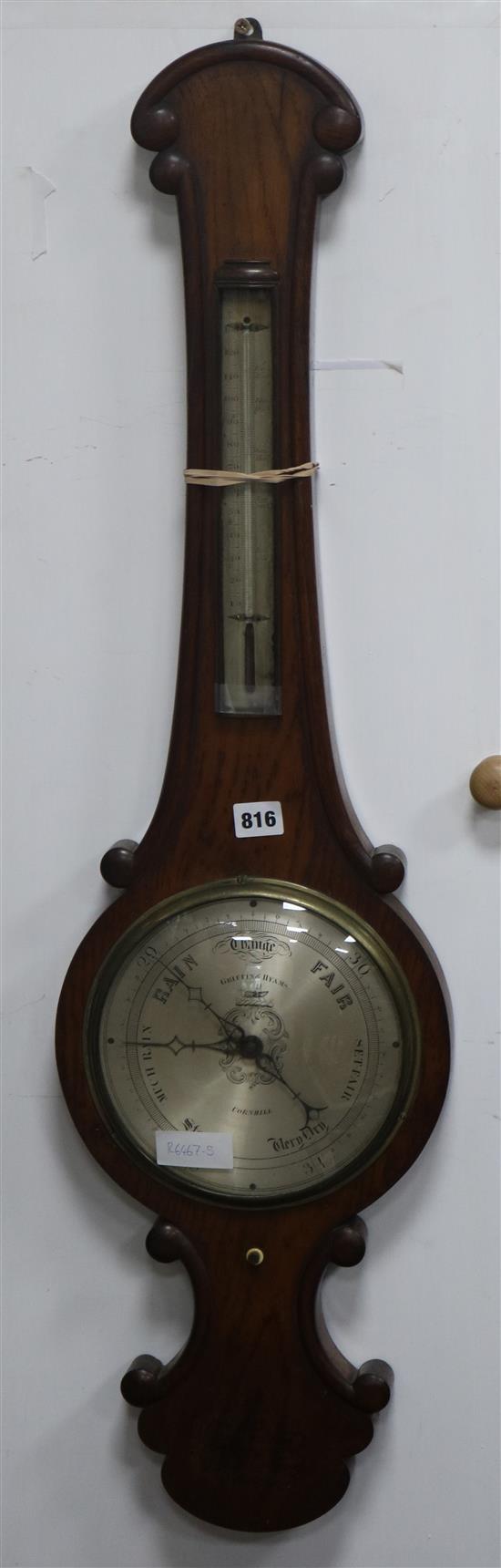 A 19th century Griffin & Hyams barometer made from oak from Royal Exchange fire 1838 W.26cm.